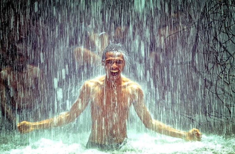man-under-waterfall-2150164_1920